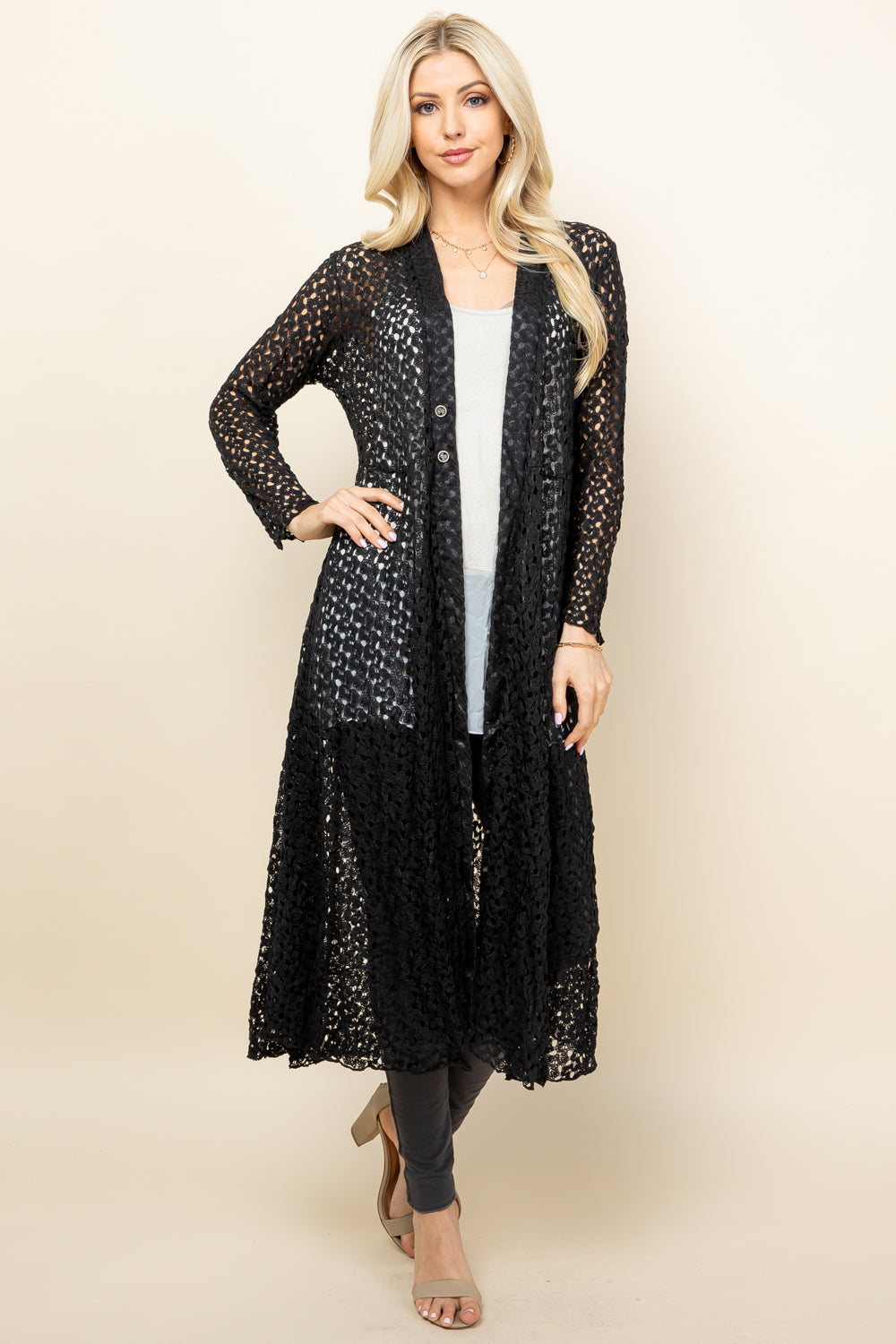 Front view of woman wearing black crochet lace long jacket – boho duster, made in USA