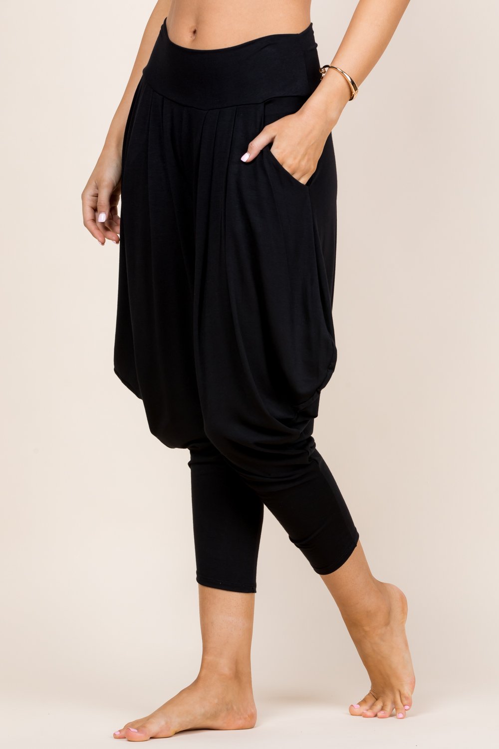 Side view of black women’s harem pants with stretch waistband – Kooniez brand