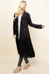 Front view of woman wearing black long velvet paisley jacket – boho duster, made in USA