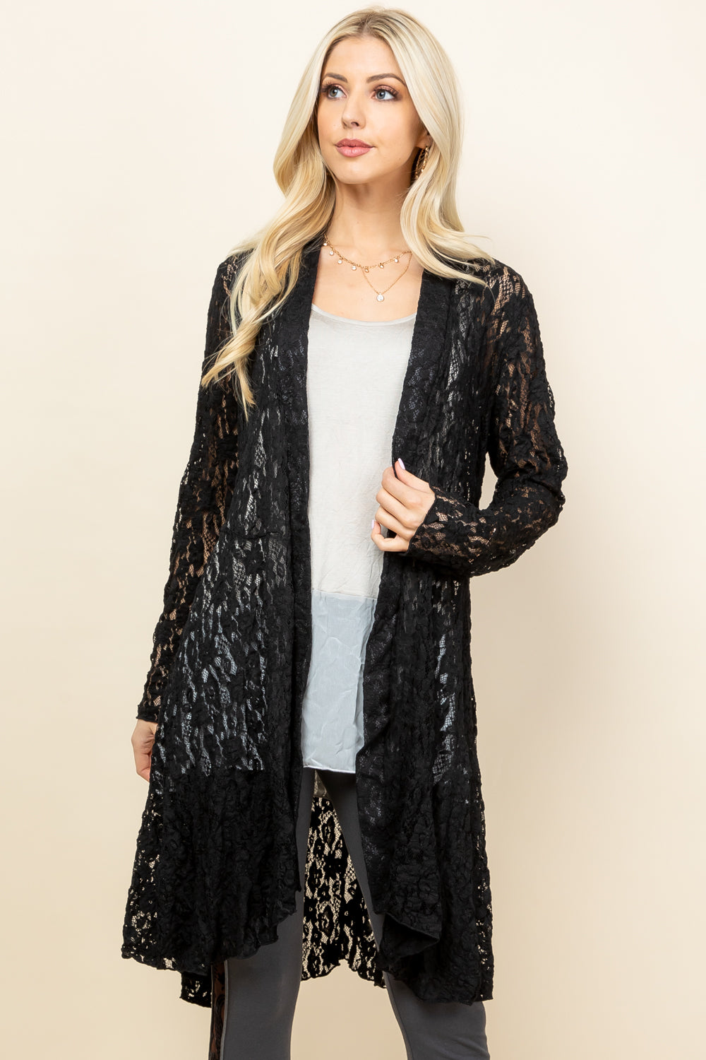 Front view of woman wearing black short pucker lace jacket – boho style, made in USA