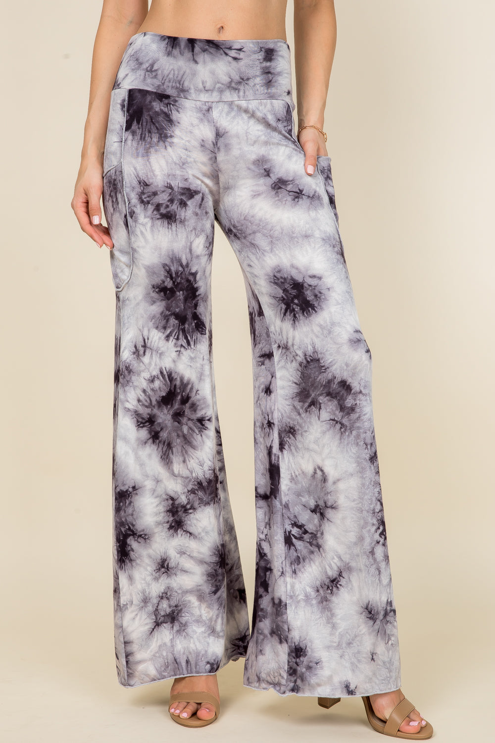 Front view of woman wearing black and white tie-dye palazzo wide leg pants – flowy lounge style, made in USA