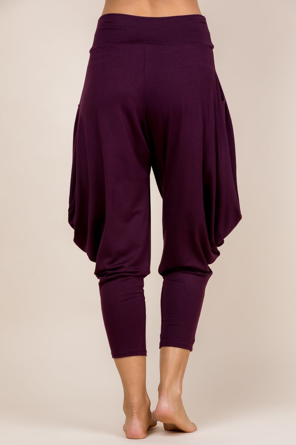 Back view of burgundy harem pants with adjustable hem and pockets – Kooniez