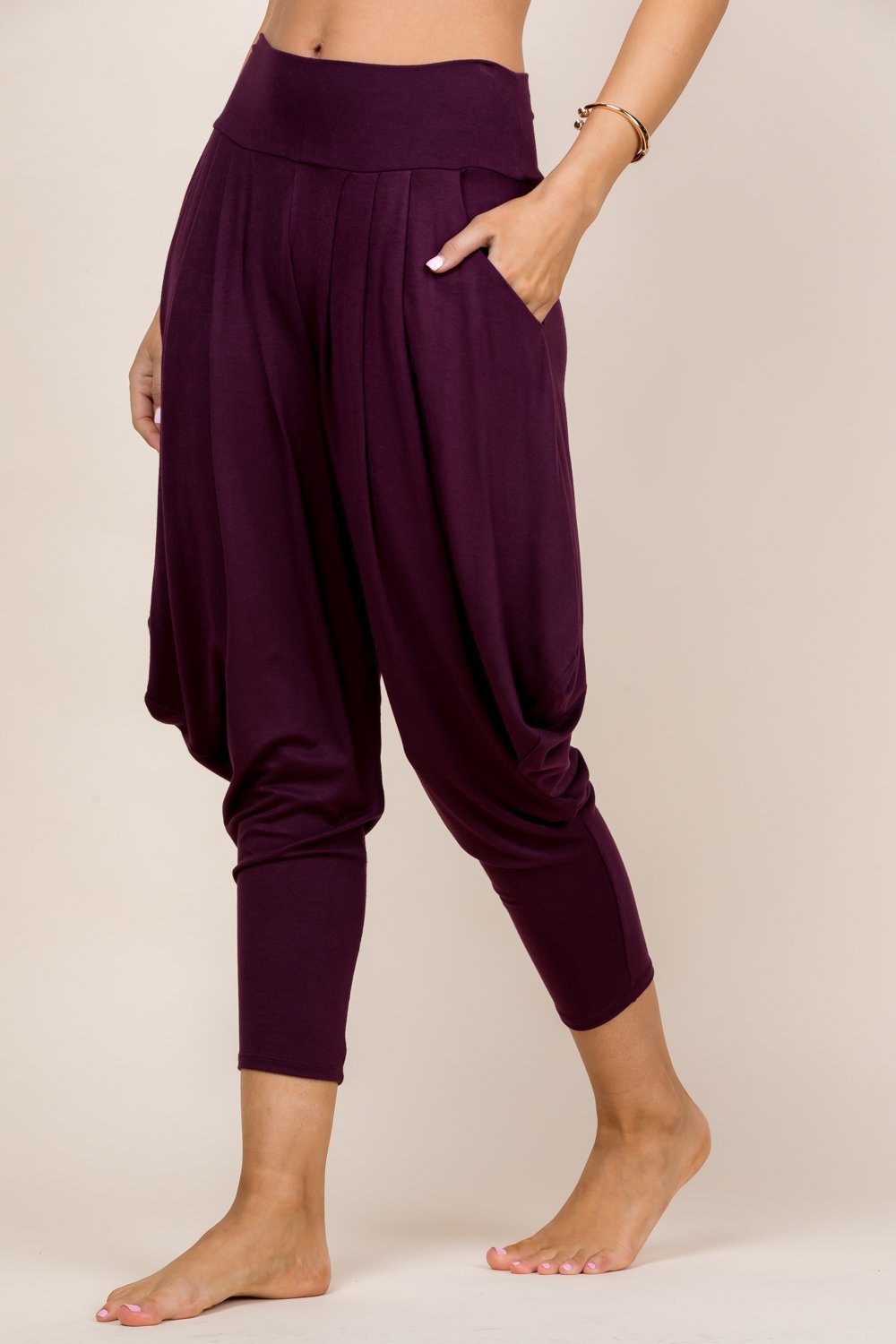 Side view of burgundy women’s harem pants with stretch waistband – Kooniez brand