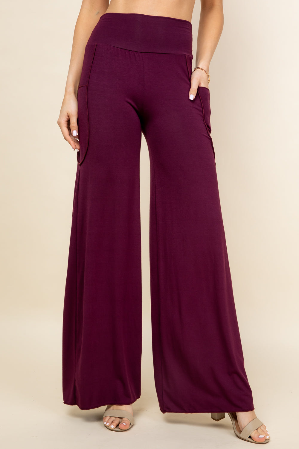 Front view of woman wearing burgundy palazzo wide leg pants – flowy lounge style, made in USA