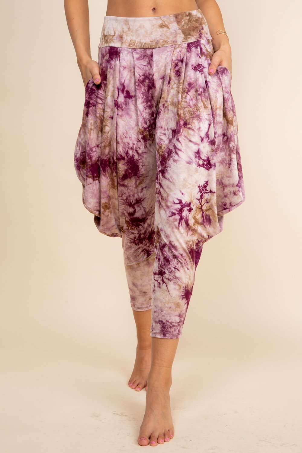 Front view of woman wearing burgundy tie-dye Kooniez harem pants with pockets – made in LA