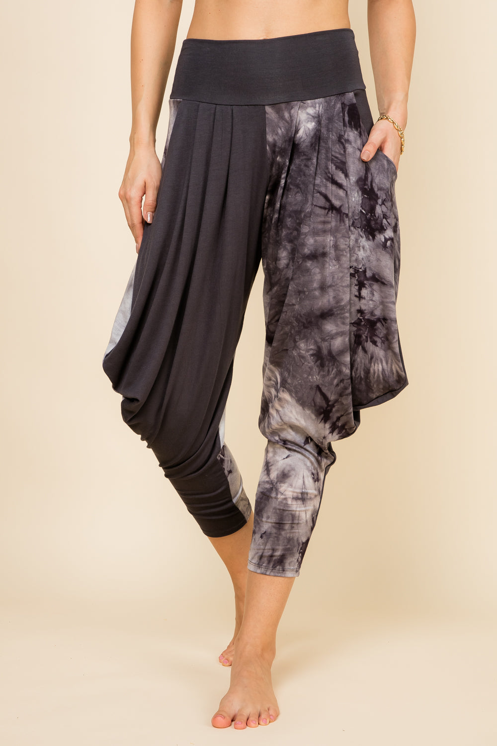 Front view of woman wearing charcoal patchwork Kooniez harem pants with pockets – made in LA