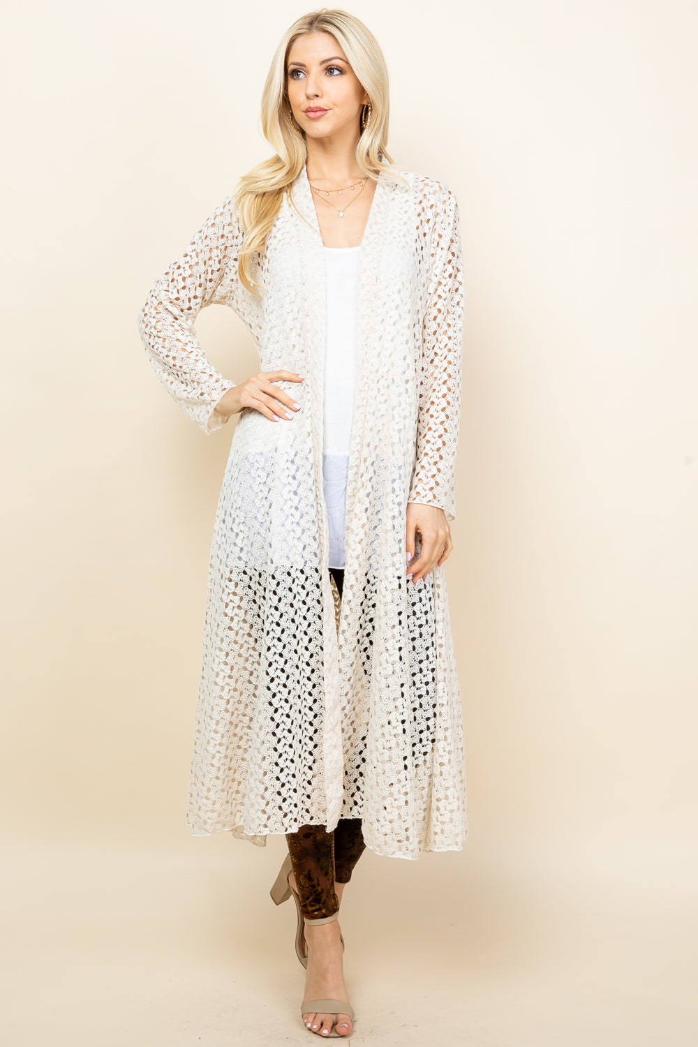 Front view of woman wearing ivory crochet lace long jacket – boho duster, made in USA