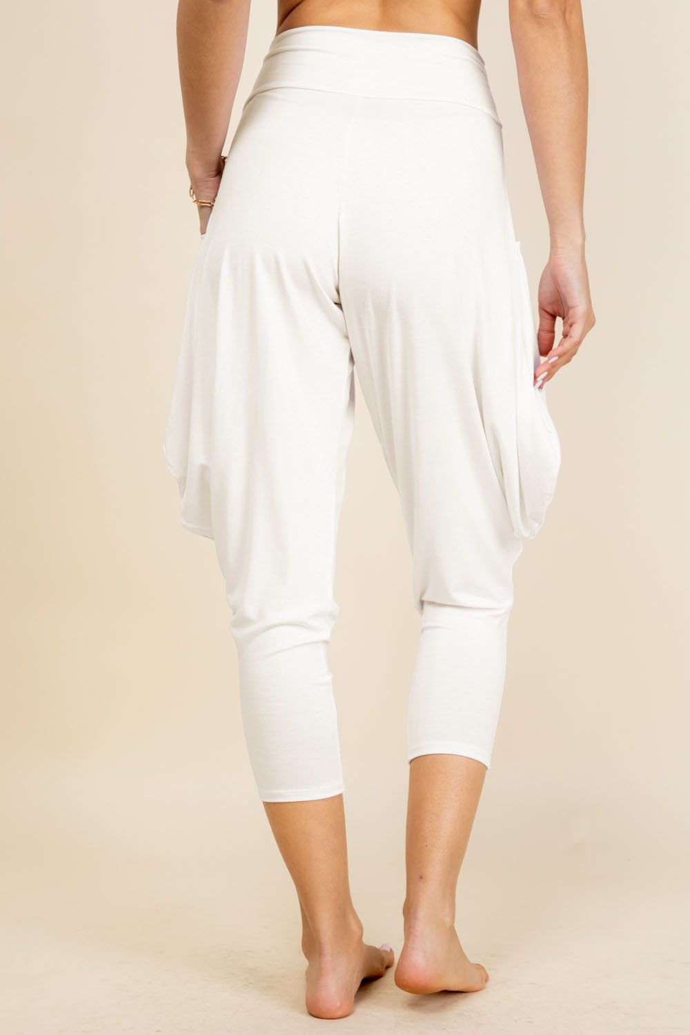 Back view of ivory harem pants with adjustable hem and pockets – Kooniez