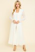 Front view of woman wearing ivory long pucker lace jacket – boho style, made in USA