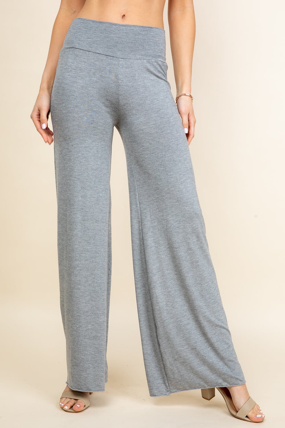 Front view of woman wearing light heather palazzo wide leg pants – flowy lounge style, made in USA