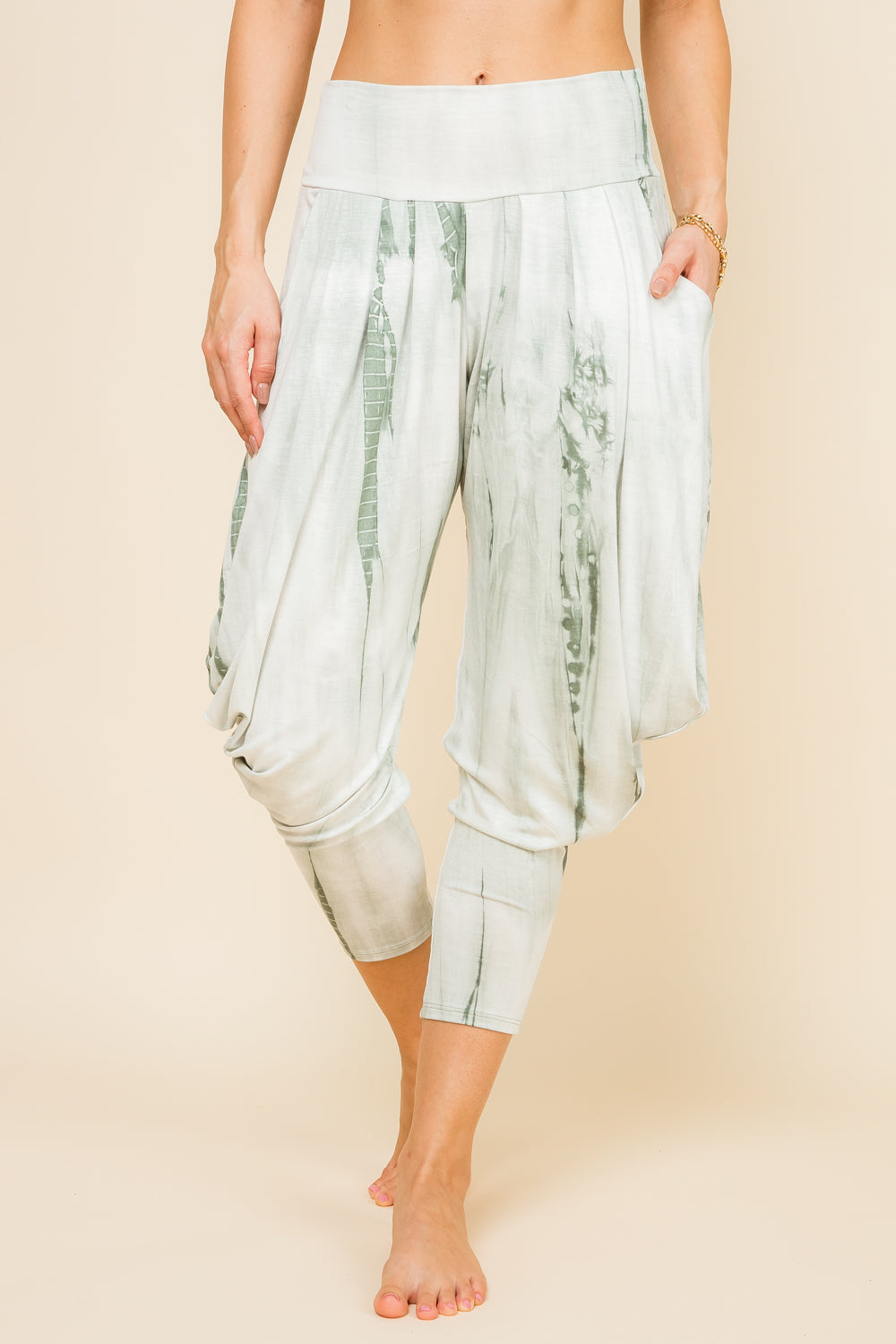 Front view of woman wearing mint marble tie-dye Kooniez harem pants with pockets – made in LA