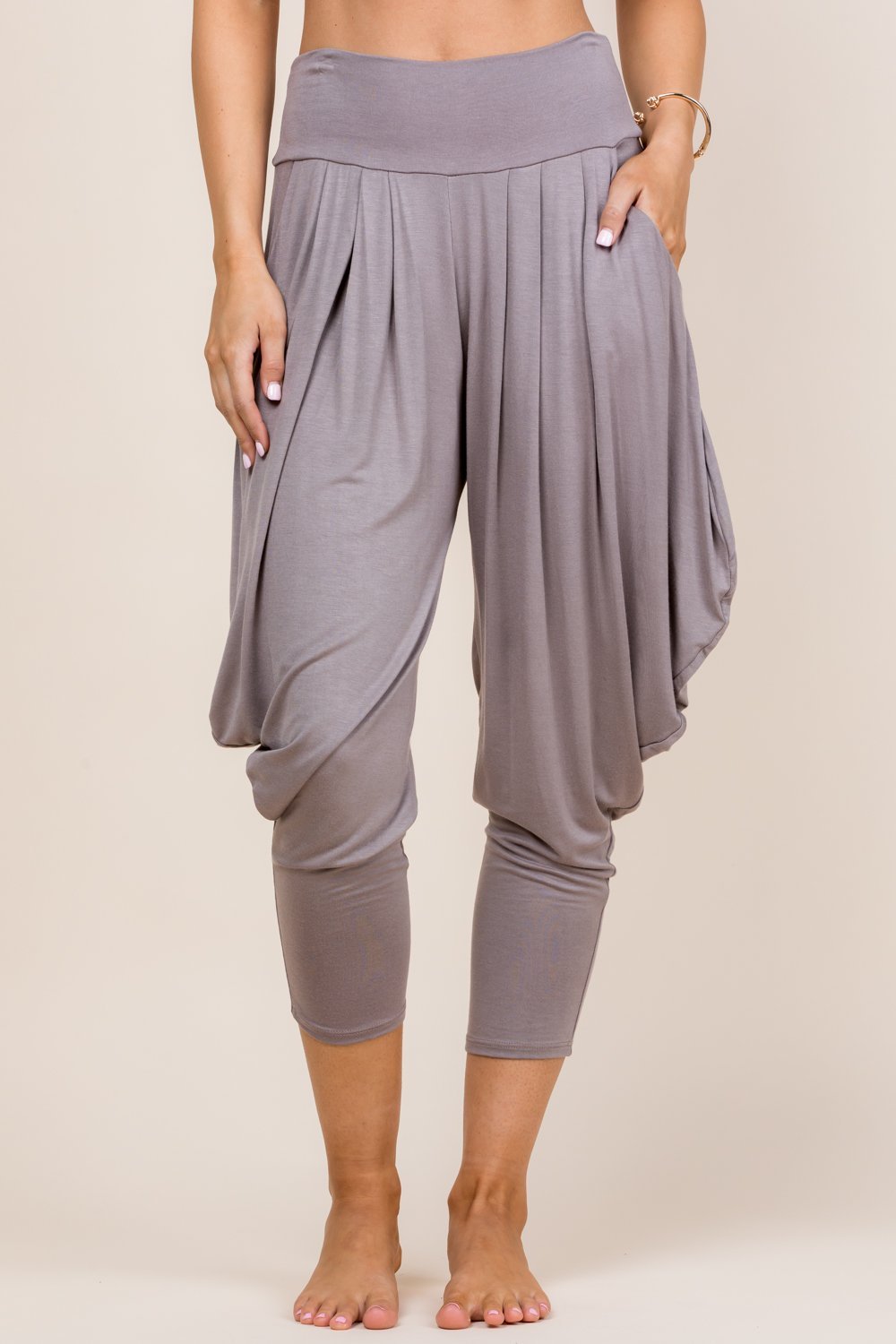 Front view of woman wearing mocha Kooniez harem pants with pockets – made in LA