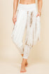 Front view of woman wearing mocha patchwork Kooniez harem pants with pockets – made in LA