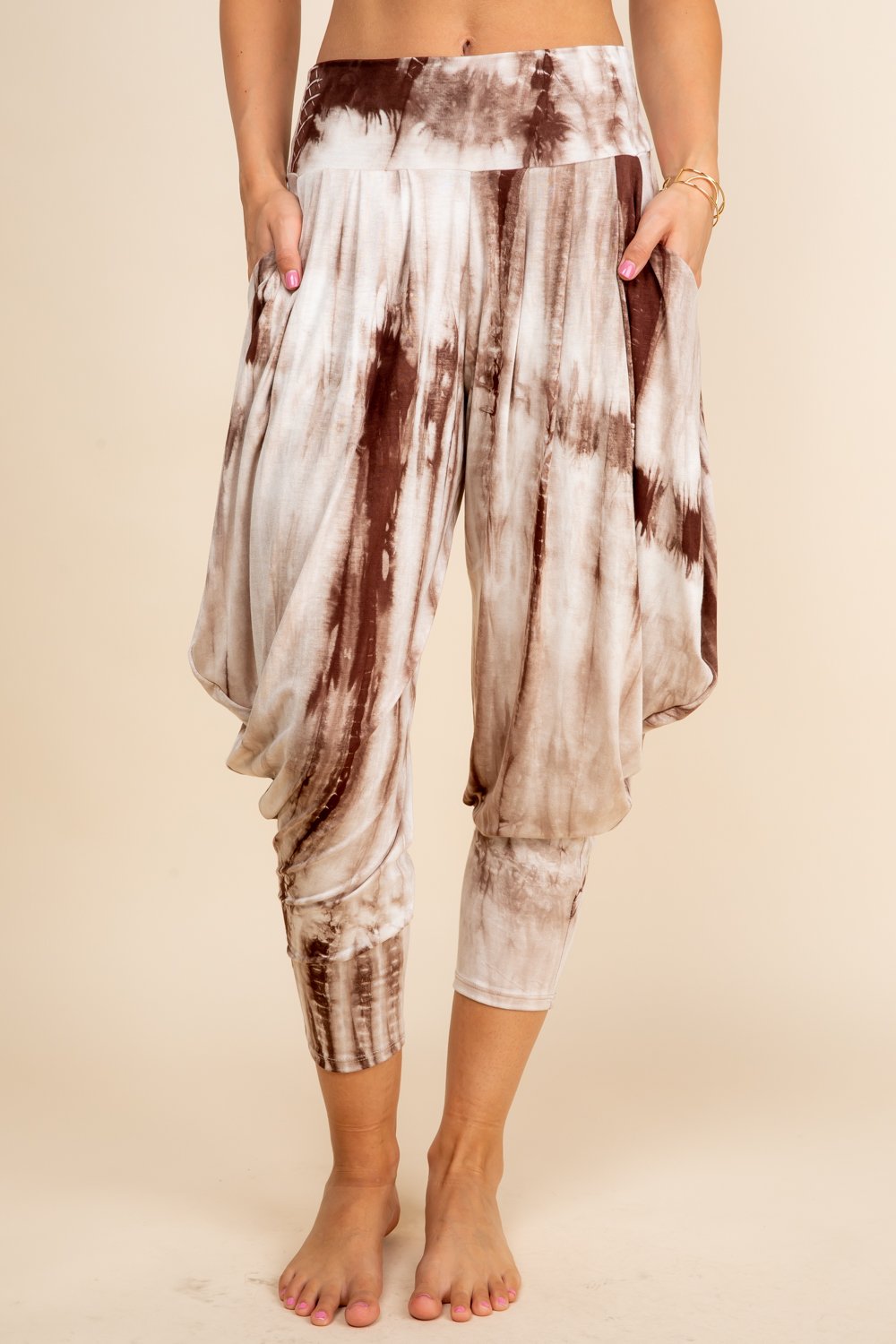 Front view of woman wearing mocha tie-dye Kooniez harem pants with pockets – made in LA