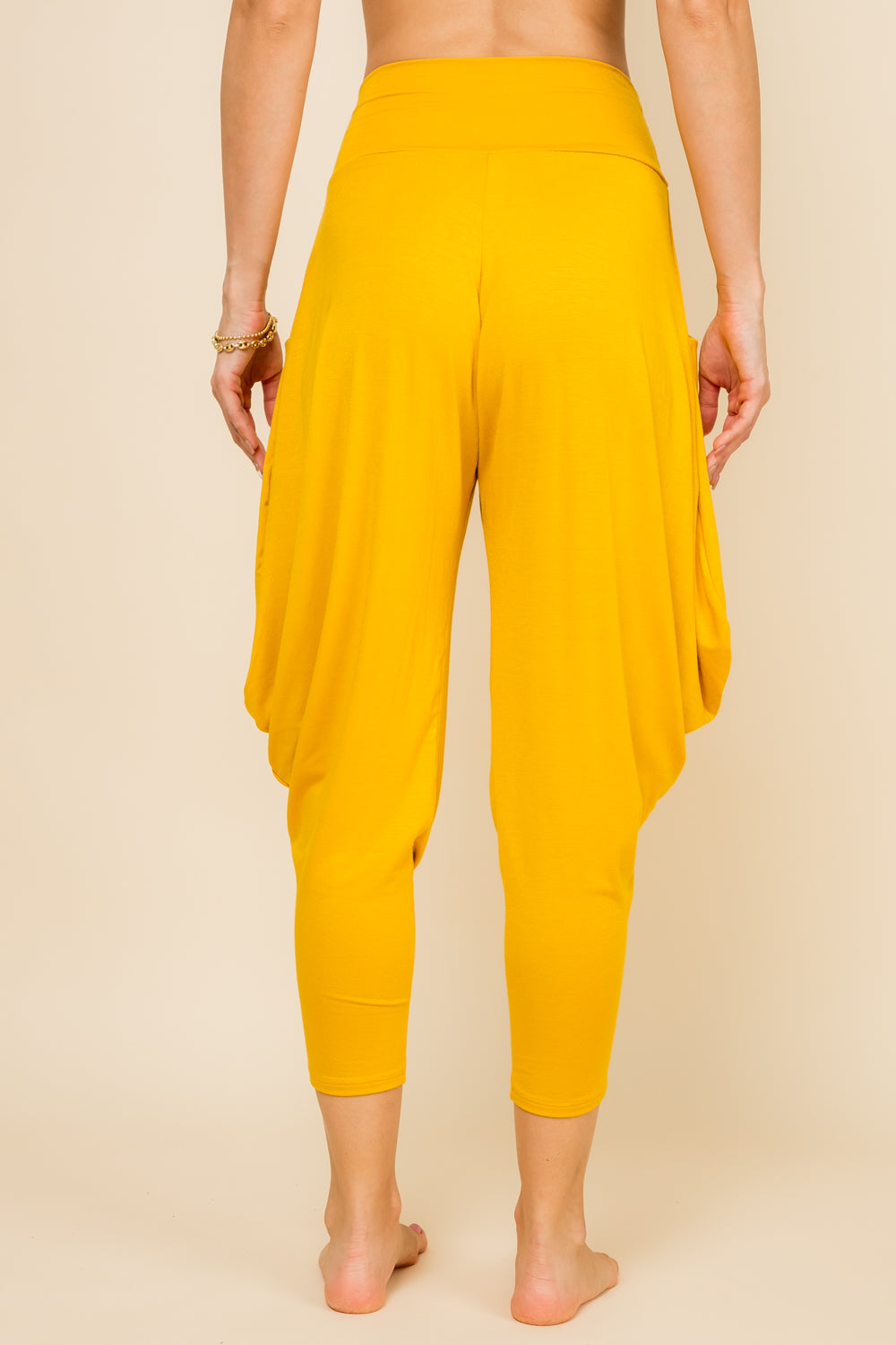 Back view of mustard harem pants with adjustable hem and pockets – Kooniez