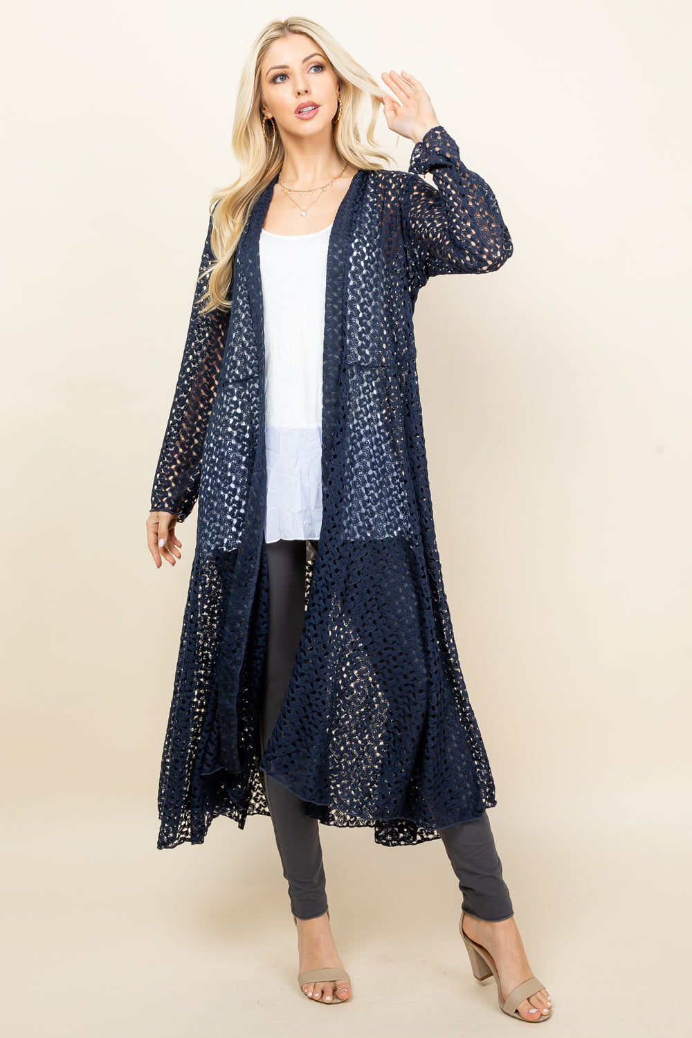 Front view of woman wearing navy blue crochet lace long jacket – boho duster, made in USA