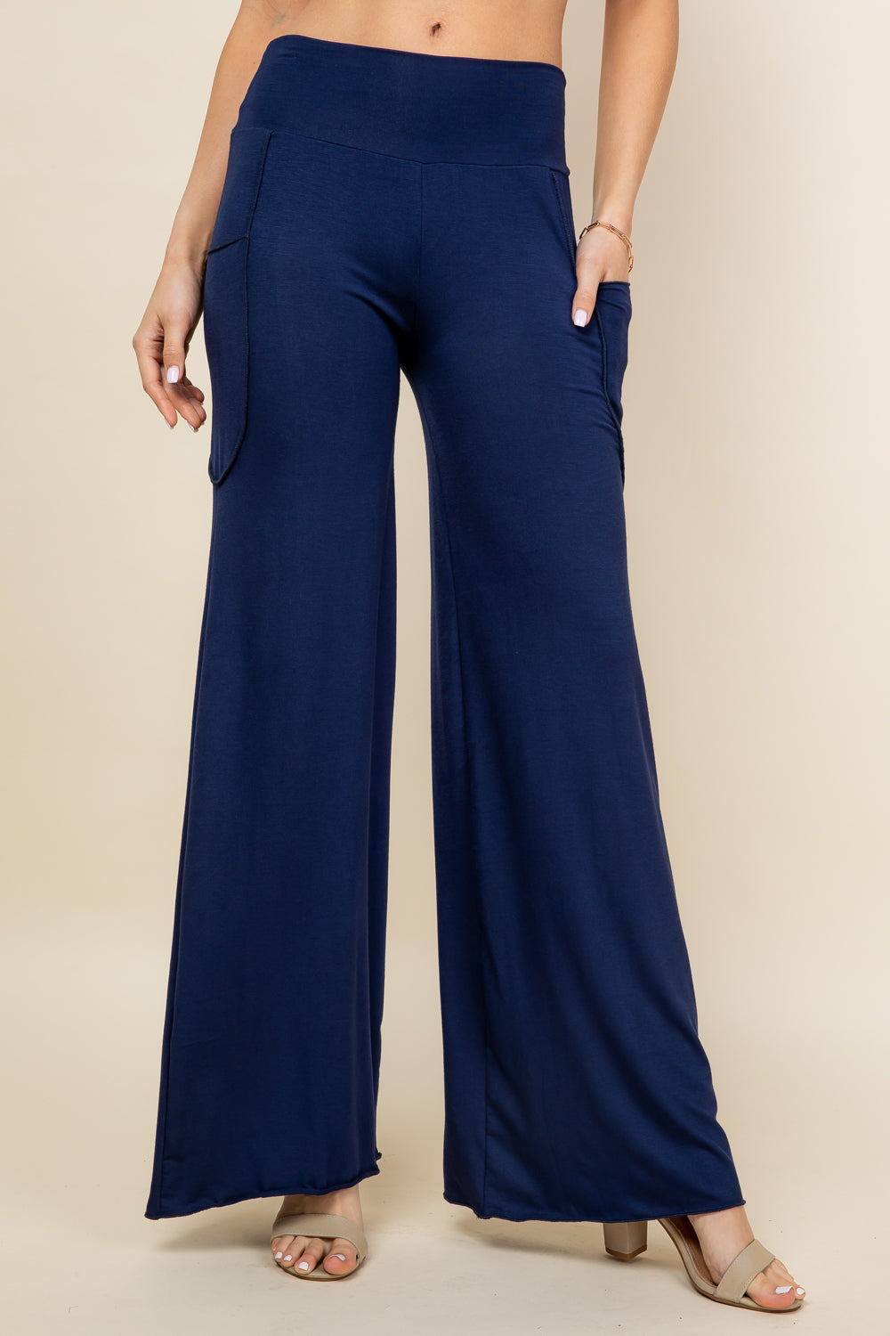 Front view of woman wearing navy blue palazzo wide leg pants – flowy lounge style, made in USA