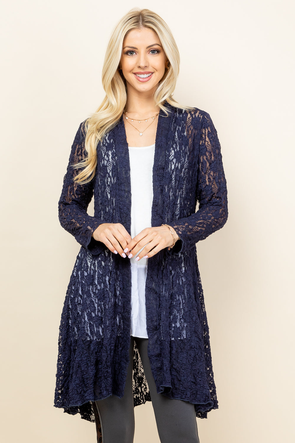 Front view of woman wearing navy blue short pucker lace jacket – boho style, made in USA