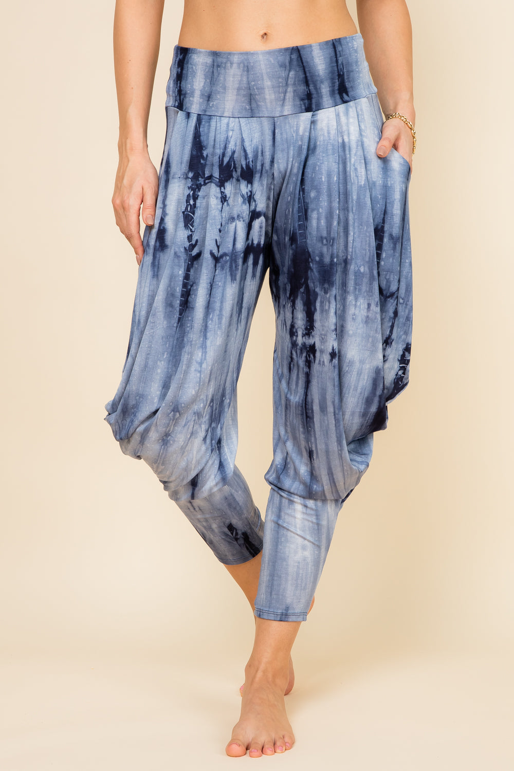 Front view of woman wearing navy marble tie-dye Kooniez harem pants with pockets – made in LA
