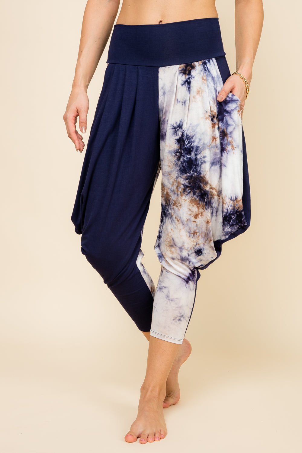 Front view of woman wearing navy patchwork Kooniez harem pants with pockets – made in LA