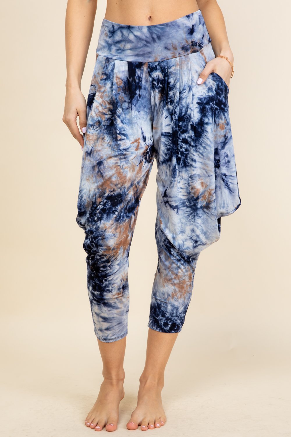 Front view of woman wearing navy tie-dye Kooniez harem pants with pockets – made in LA