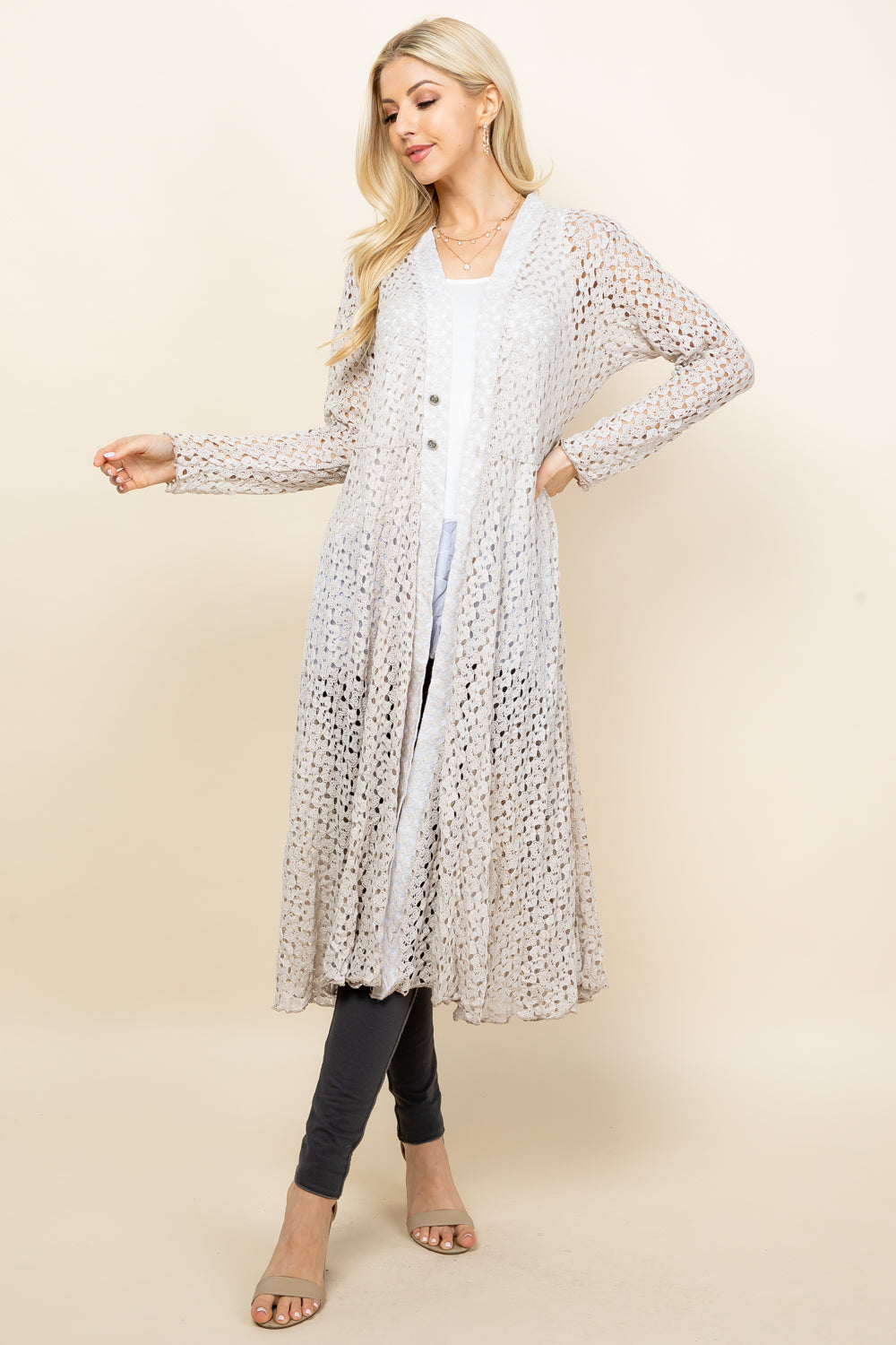 Front view of woman wearing oatmeal crochet lace long jacket – boho duster, made in USA