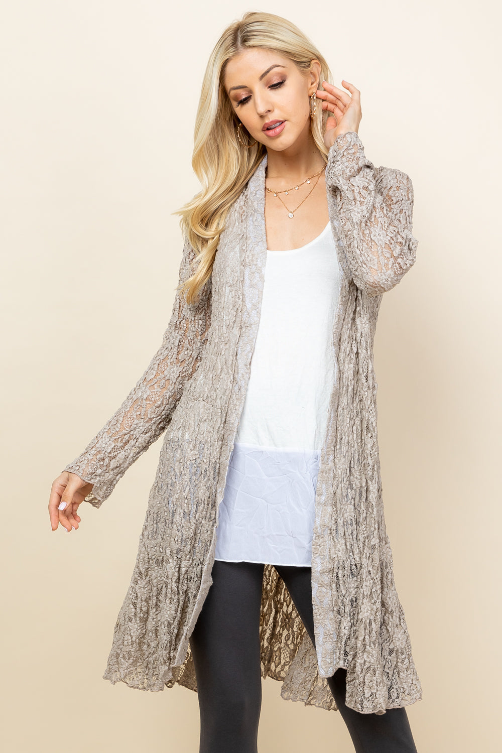 Front view of woman wearing oatmeal short pucker lace jacket – boho style, made in USA