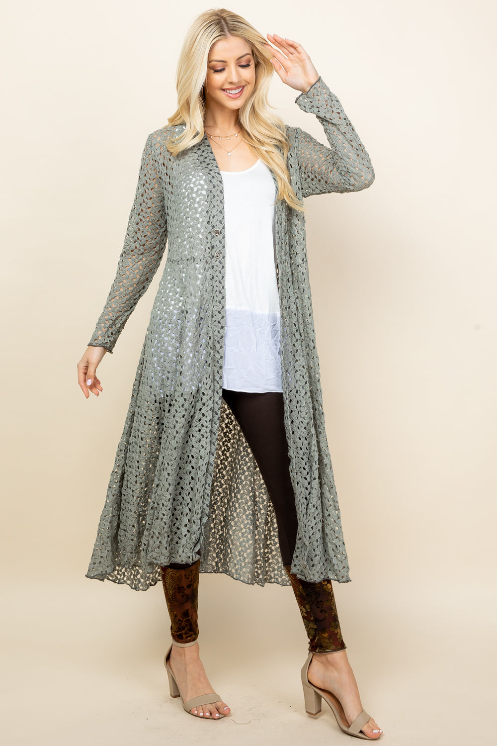 Front view of woman wearing sage crochet lace long jacket – boho duster, made in USA