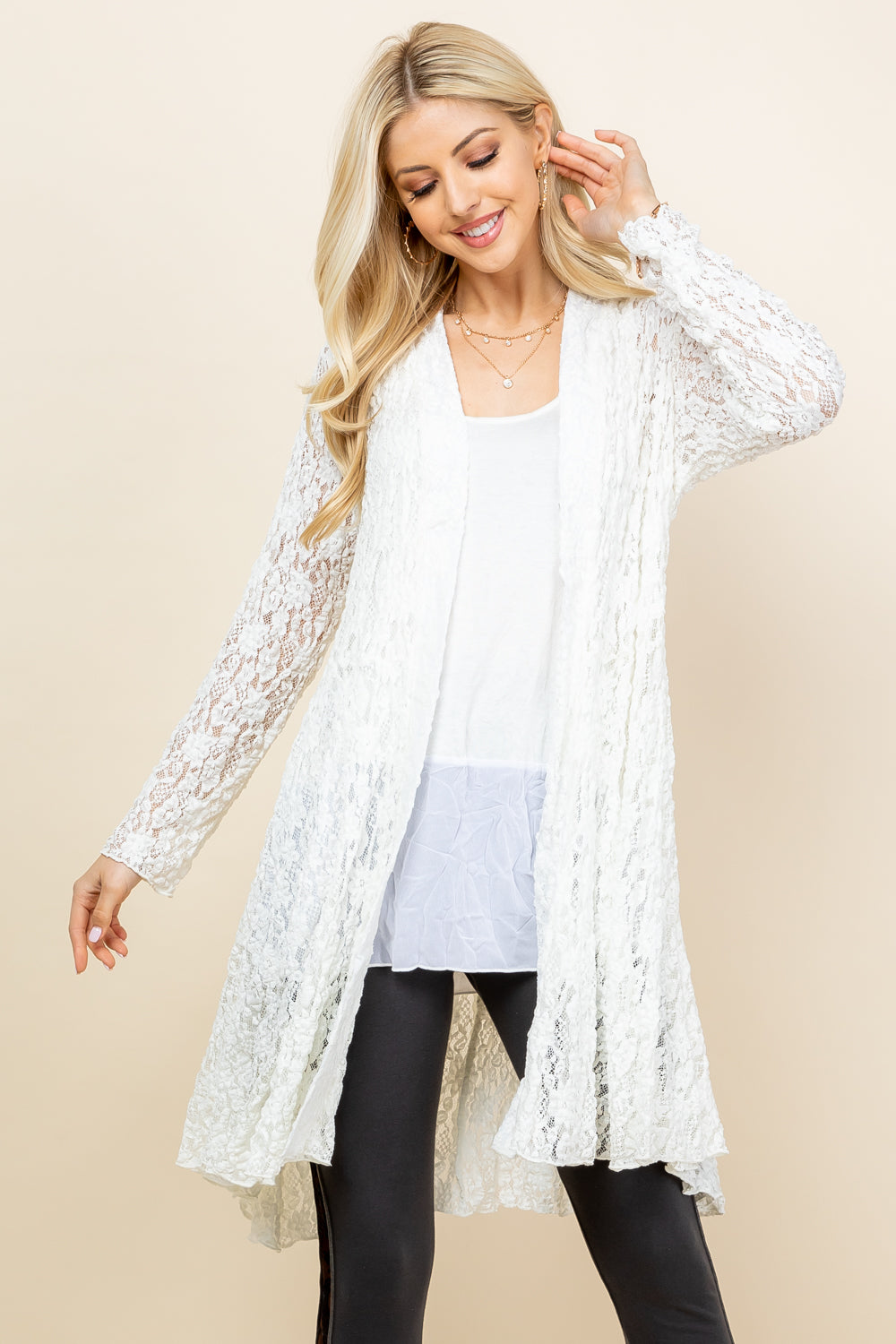 Front view of woman wearing white short pucker lace jacket – boho style, made in USA