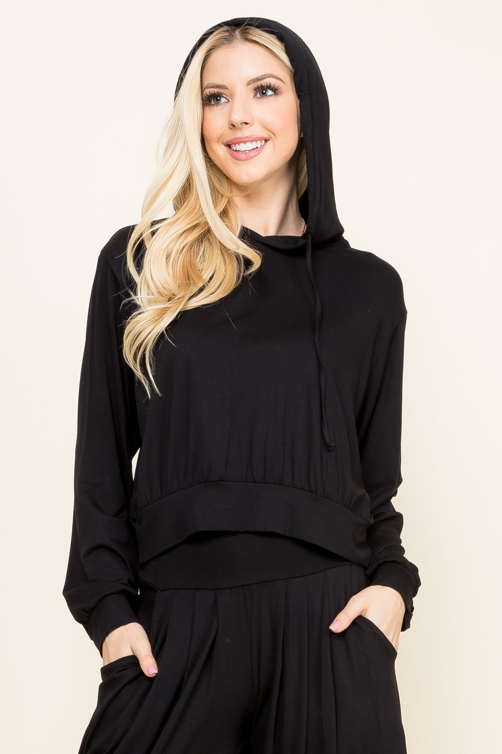 Front view of woman wearing black cropped hoodie – soft loungewear hoodie, made in USA