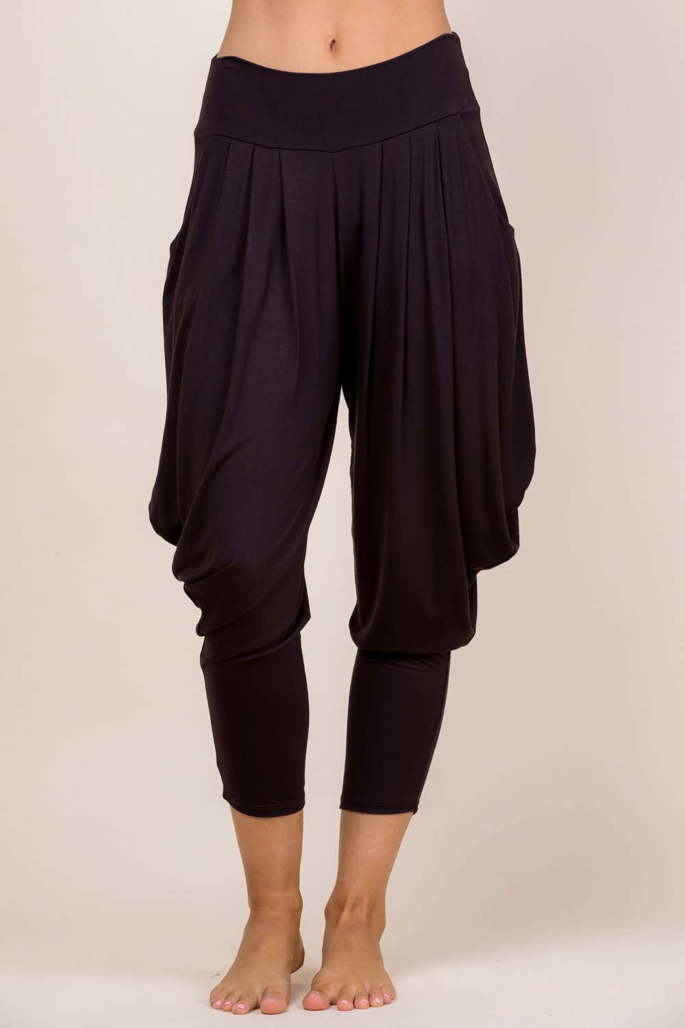 Front view of woman wearing brown Kooniez harem pants with pockets – made in LA