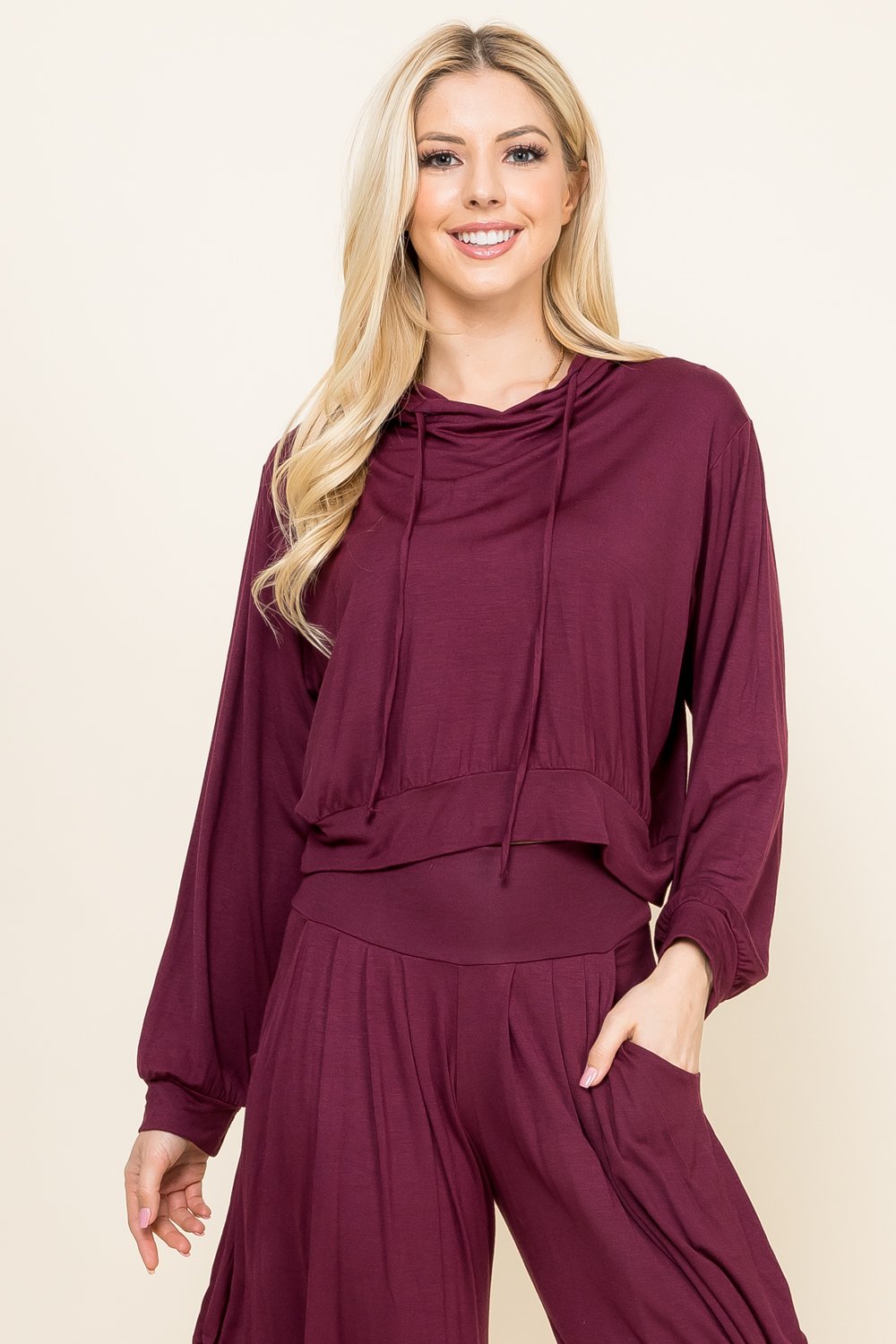 Front view of woman wearing burgundy cropped hoodie – soft loungewear hoodie, made in USA