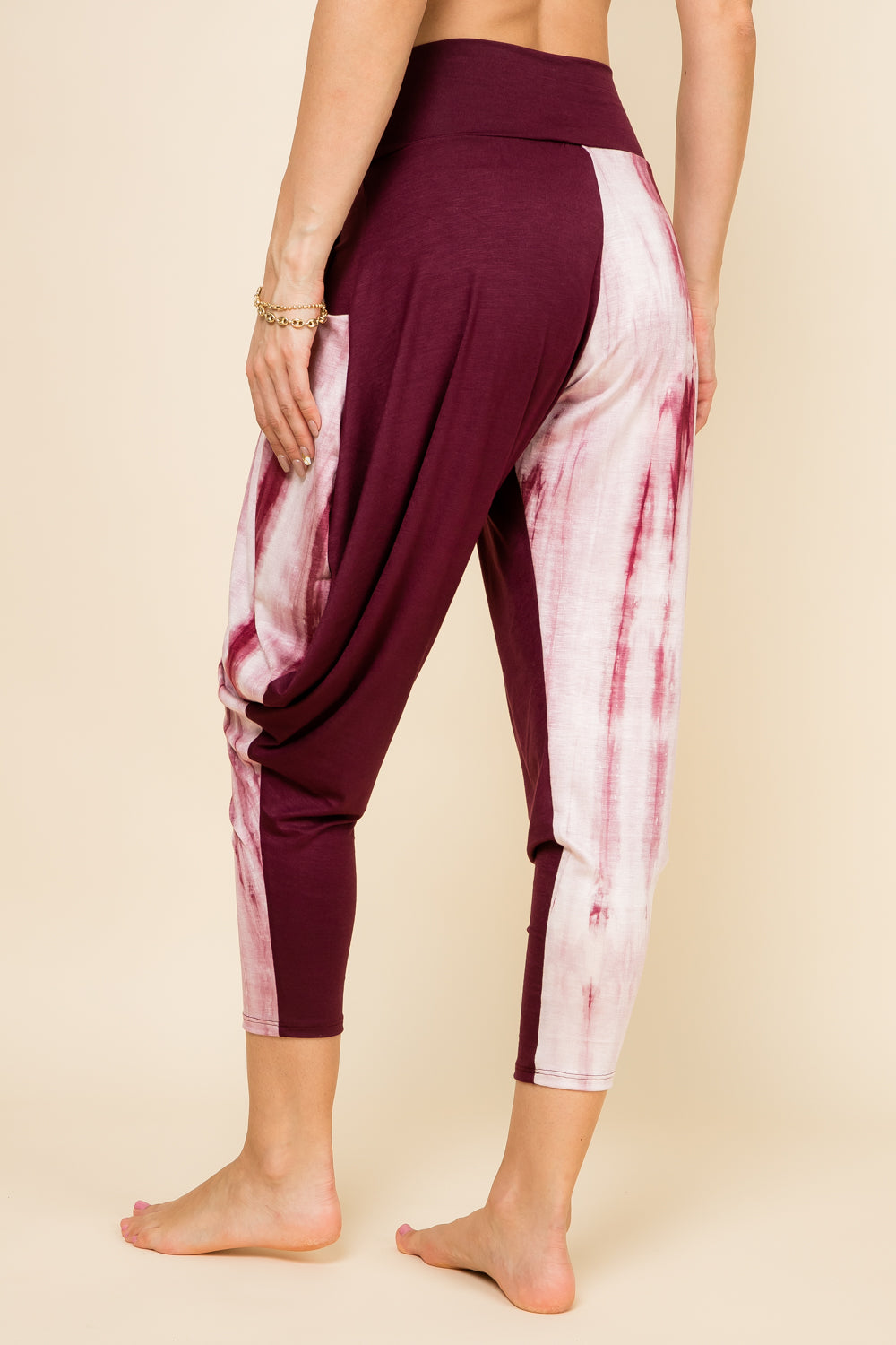 Back view of burgundy marble patchwork harem pants with adjustable hem and pockets – Kooniez