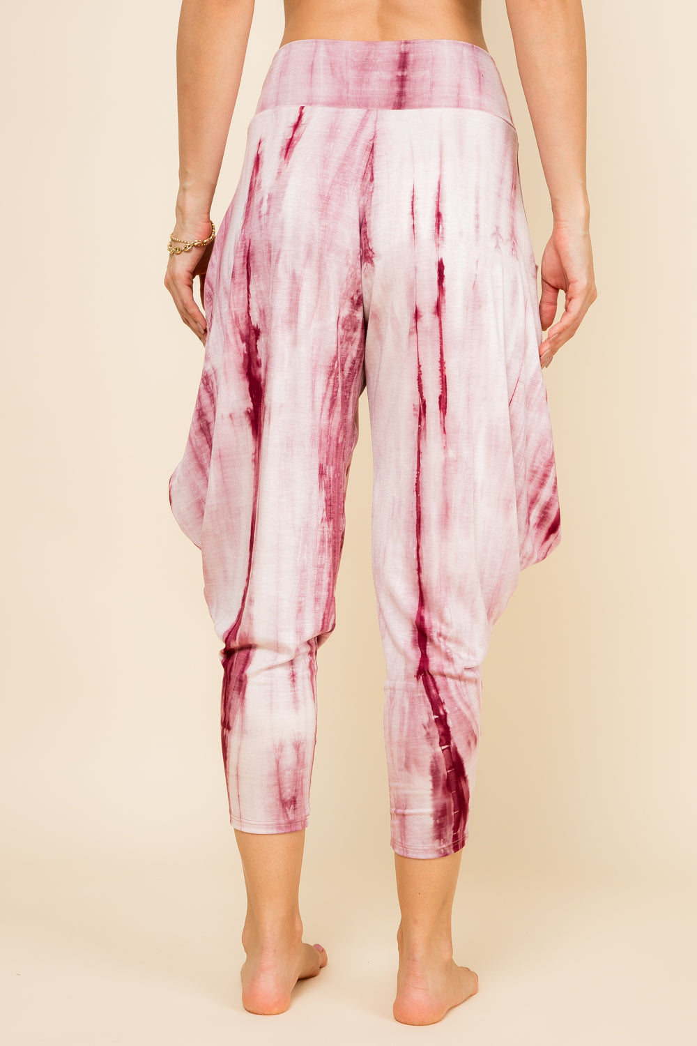 Back view of burgundy marble tie-dye harem pants with adjustable hem and pockets – Kooniez