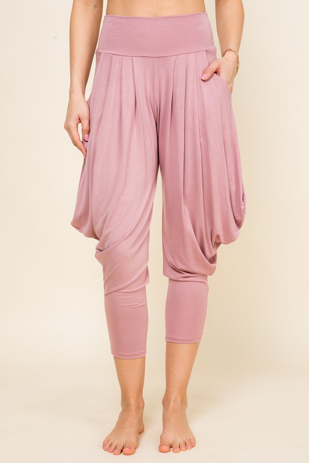 Front view of woman wearing mauve Kooniez harem pants with pockets – made in LA