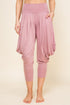 Front view of woman wearing mauve Kooniez harem pants with pockets – made in LA