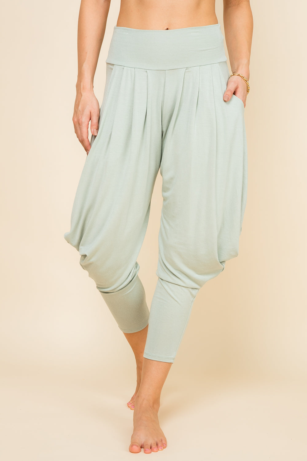 Front view of woman wearing mint Kooniez harem pants with pockets – made in LA
