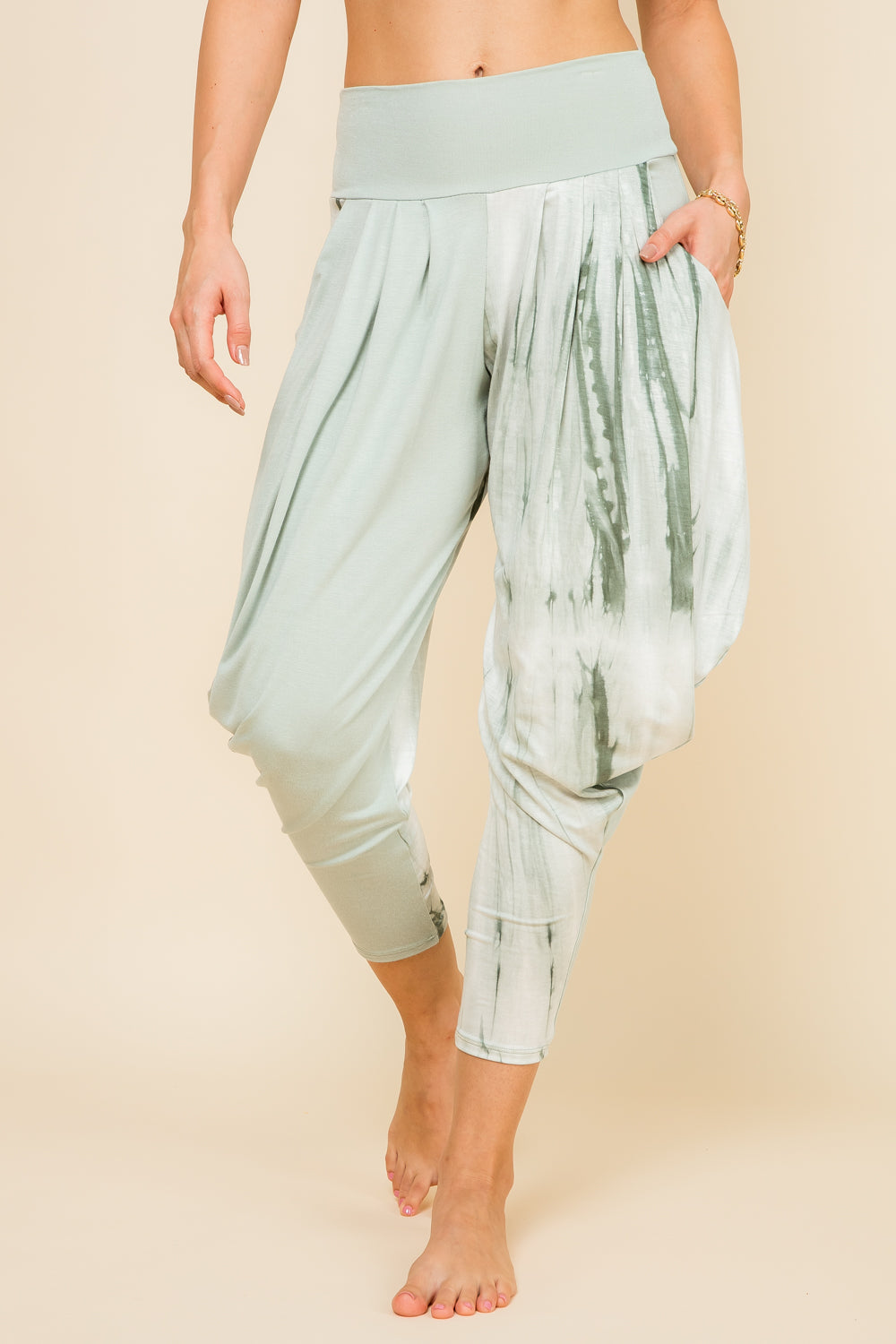 Front view of woman wearing mint marble patchwork Kooniez harem pants with pockets – made in LA