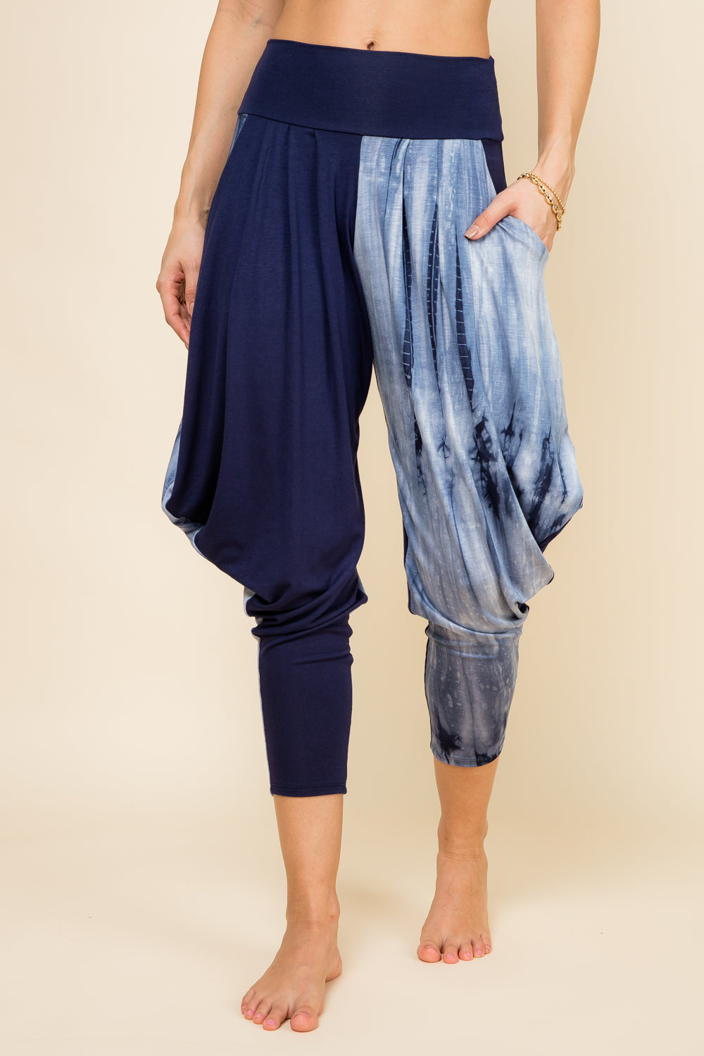 Front view of woman wearing navy marble patchwork Kooniez harem pants with pockets – made in LA